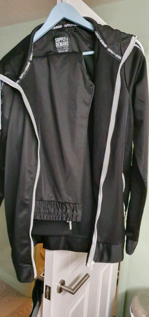 supply and demand red tracksuit